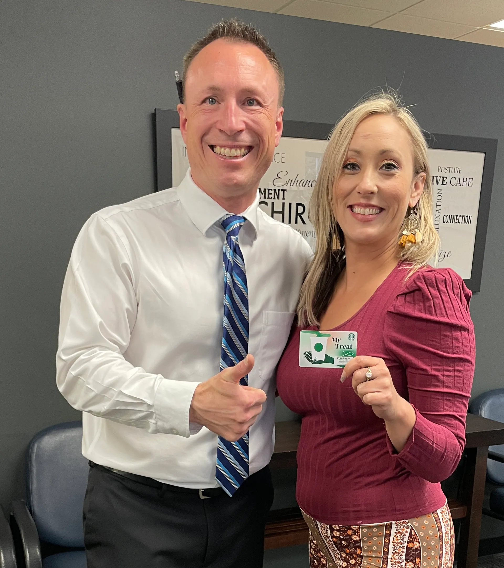 Dr. Charlie Gray with patient celebrating chiropractic progress