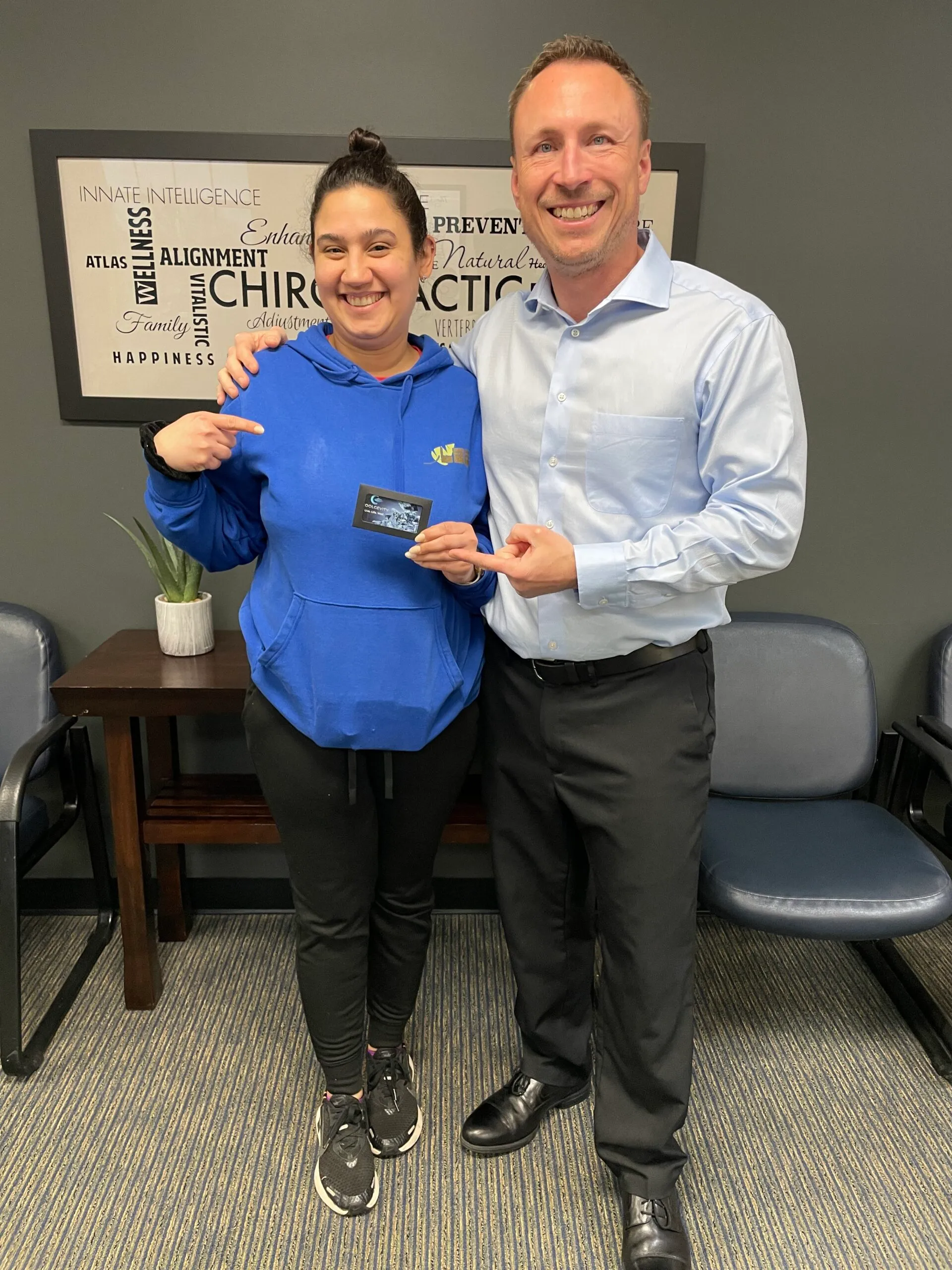 Dr. Charlie Gray posing with patient after successful treatment