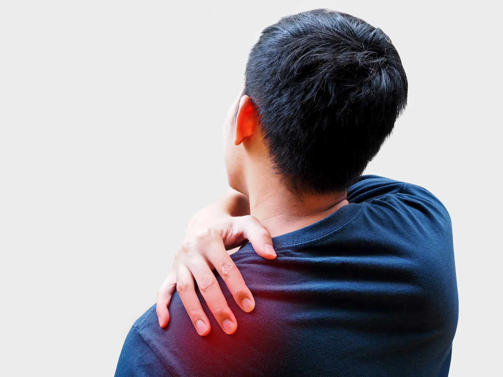 Young Asian man suffering from back pain, shoulder pain