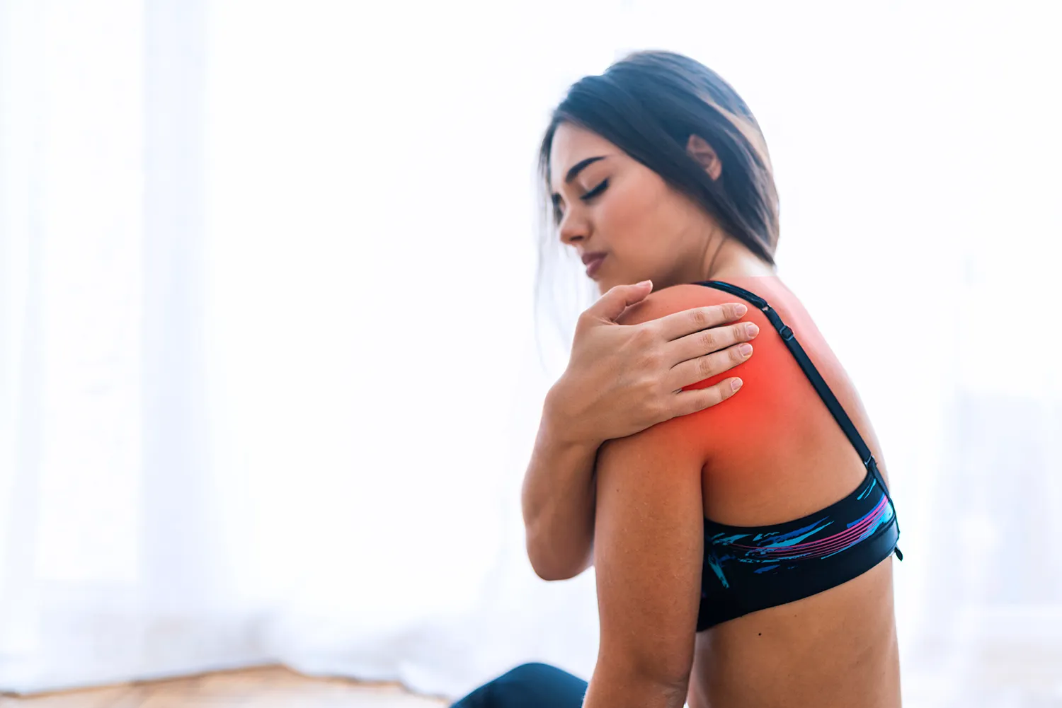 asian woman having a shoulder pain