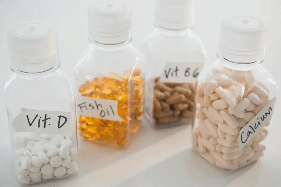 Jars of vitamin D, fish oil, vitamin B6 and calcium supplements