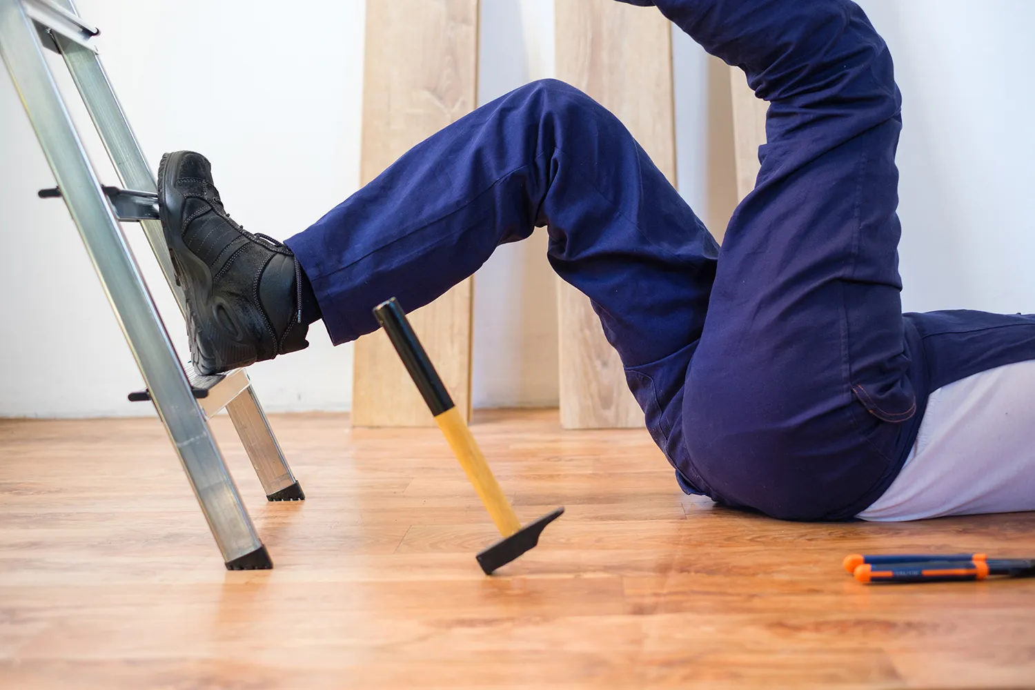 man falls into the ladder